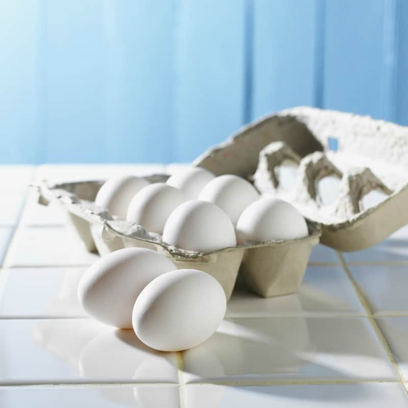 eggs in a carton on a white counter