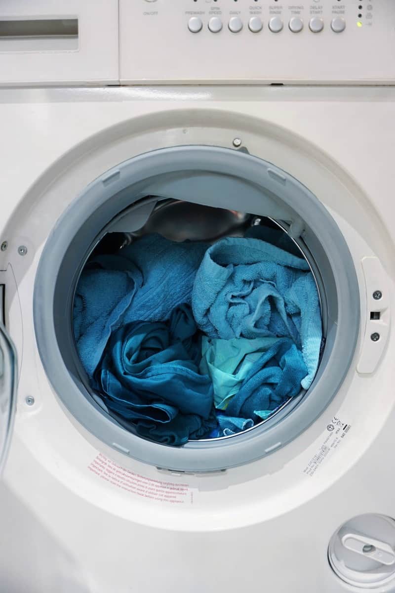 washing machine with clothes in it