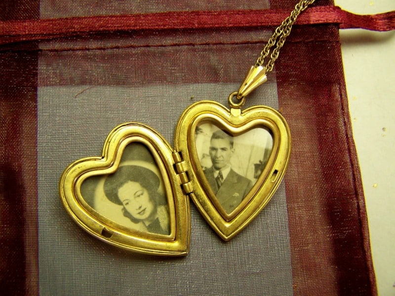 a gold locket with old photos in it