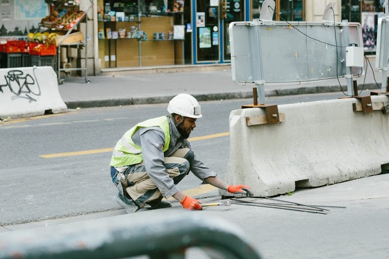 man wearing a uniform working on road construction