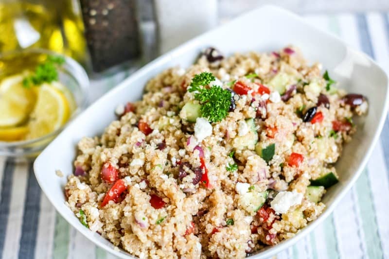 quinoa salad with vegetables in a white bowl
