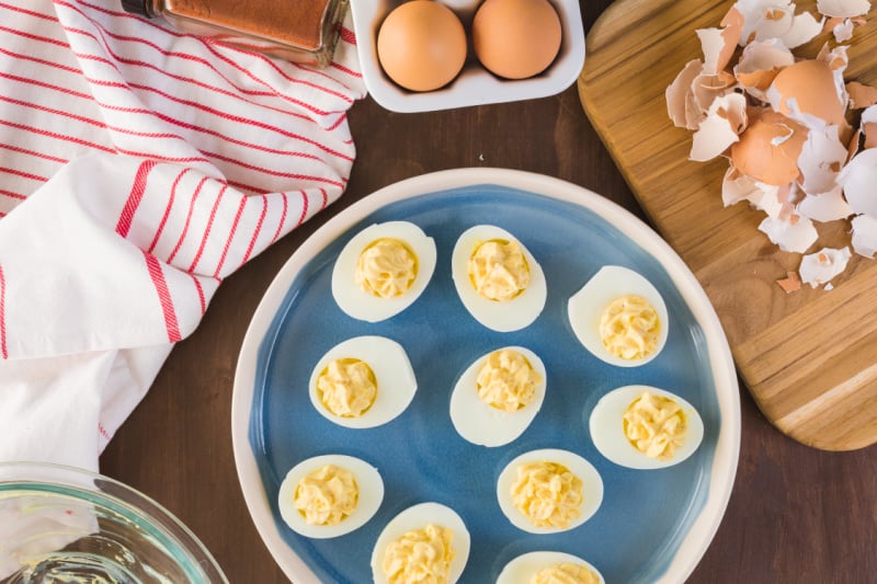 deviled eggs on a blue serving dish