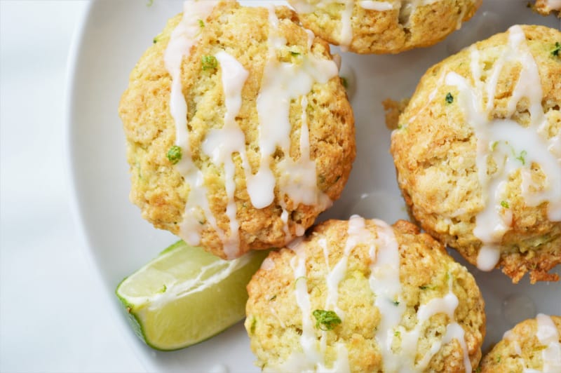 a close up of a plate of zucchini lime muffins