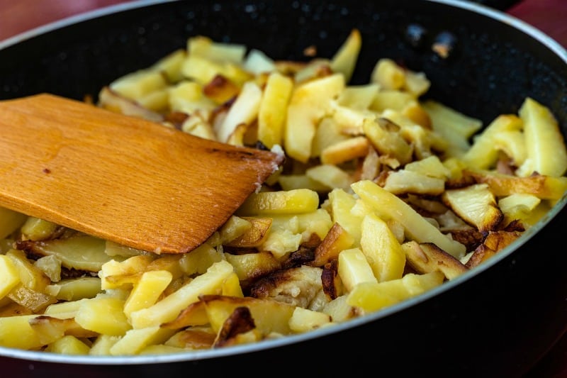 cooking hash browns in a pan