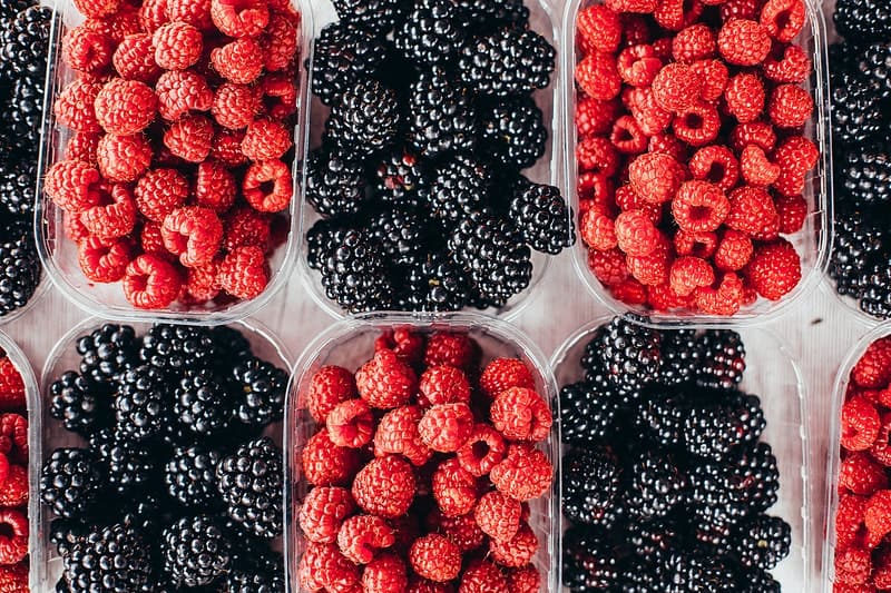 fresh berries in plastic containers