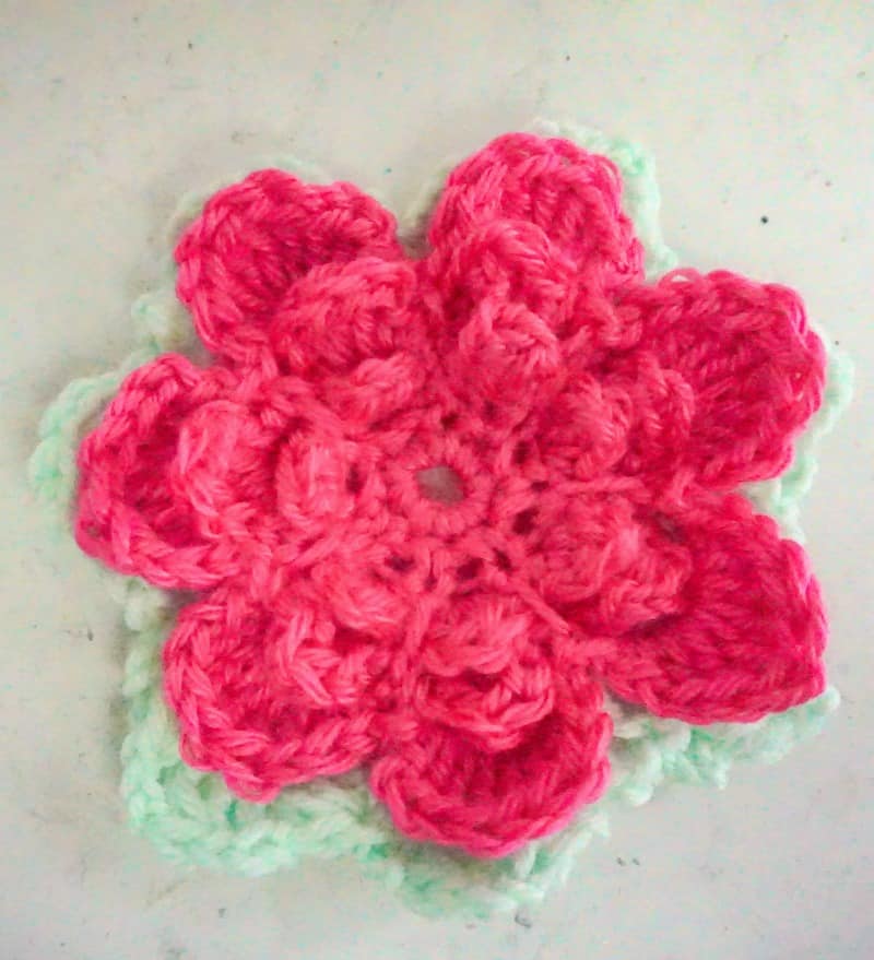 crocheted flower with leaves