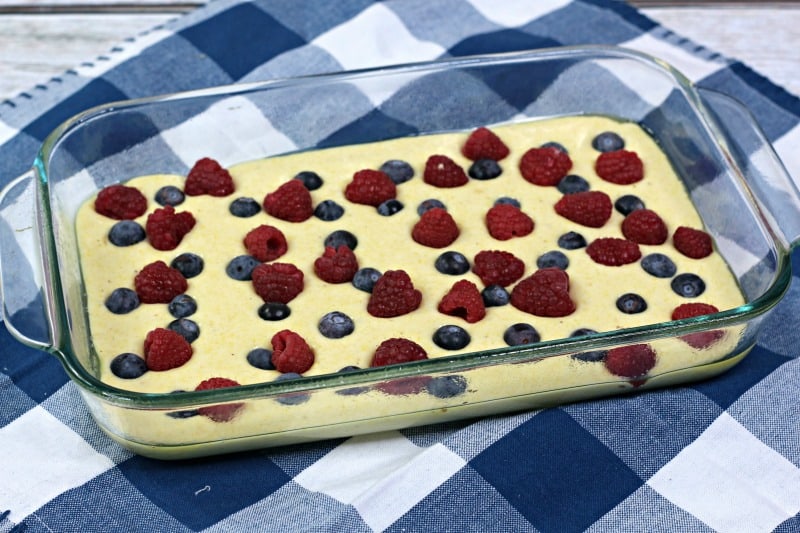 cornbread batter in a pan with fruit