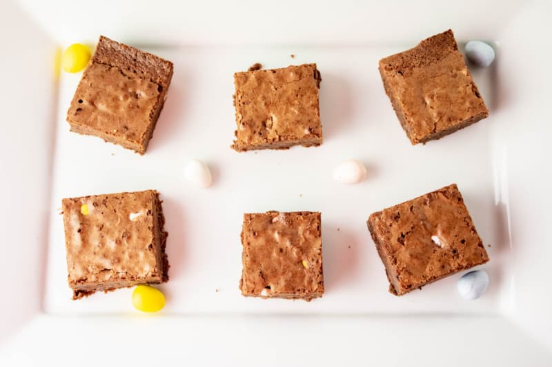 brownies on a white plate with Easter candy