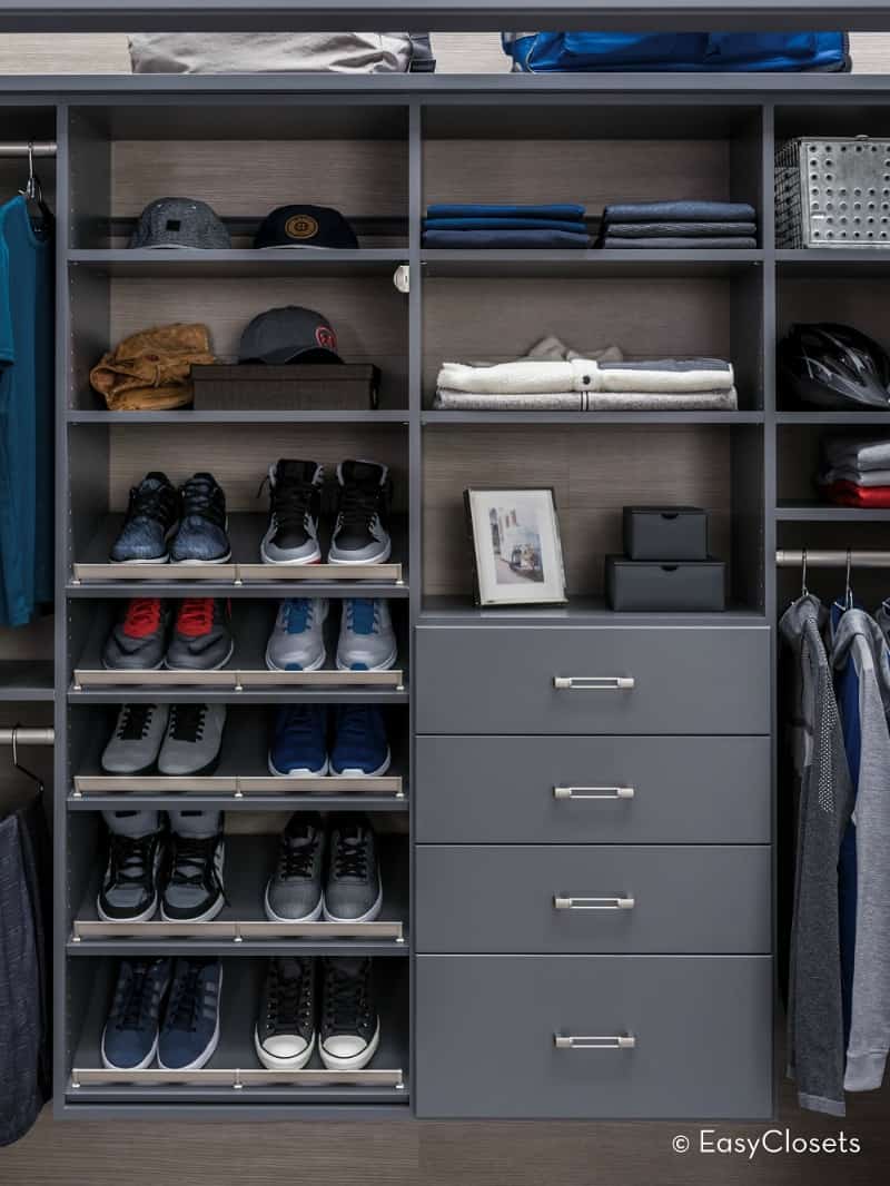 an organized closet in gray tones