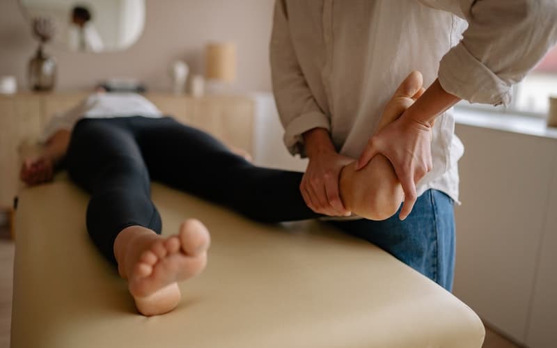 a woman having a foot exam