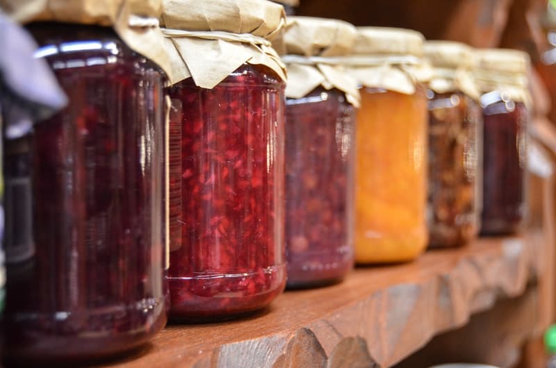 a row of jams on a shelf