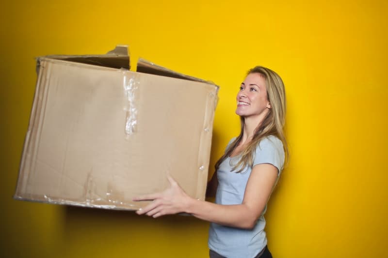 woman holding a large box