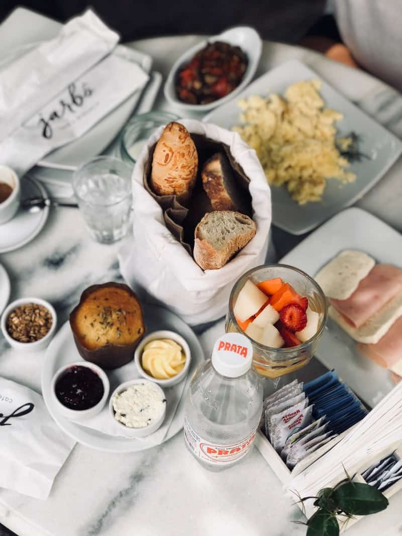 breakfast on a table with white linens