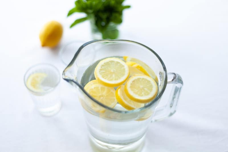 lemon slices in water in a pitcher