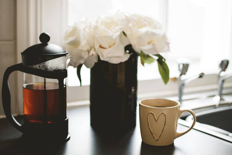 coffee and a vase of flowers
