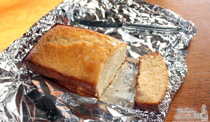 a loaf of lemon bread on tin foil near a knife