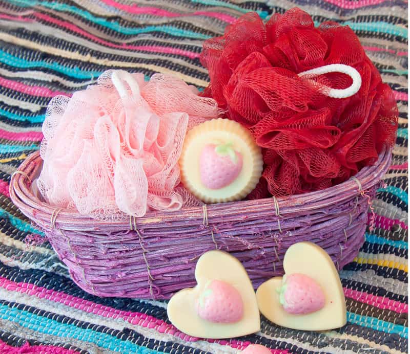 a pretty basket of soaps and bath puffs