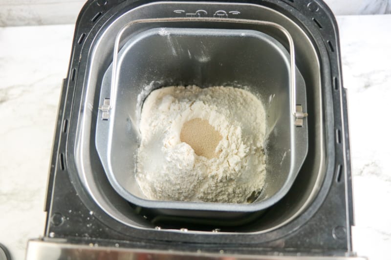 a bread machine with ingredients in it