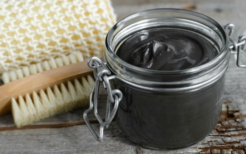 activated charcoal mask in a jar
