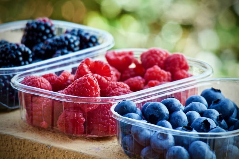 fresh berries in containers