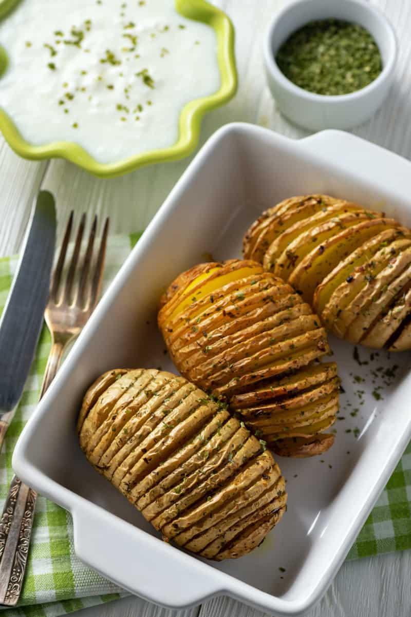 Wondering how to make hasselback potatoes? Try these sour cream and chive hasselback potatoes today for easy accordion potatoes.