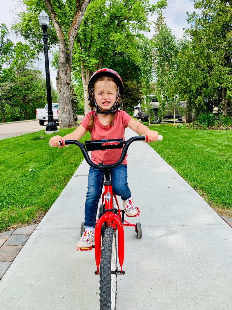 young girl riding a bike