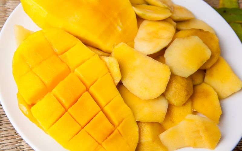 fresh mango sliced on a plate