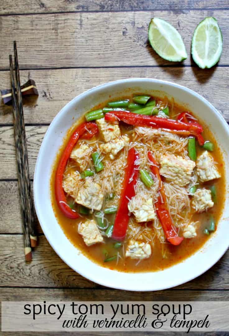 Cooking healthy meals at home - spicy tom yum soup with vermicelli and tempeh