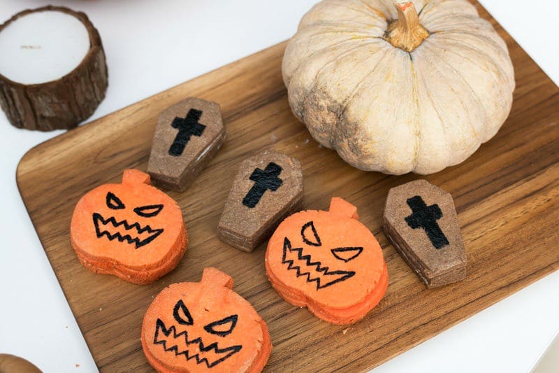 Halloween themed snacks on a cutting board