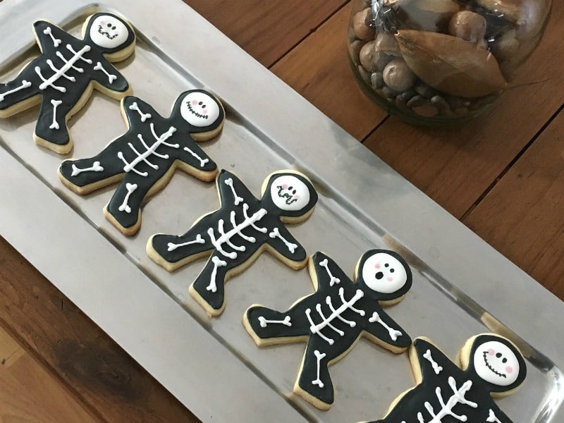 a tray of skeleton cookies