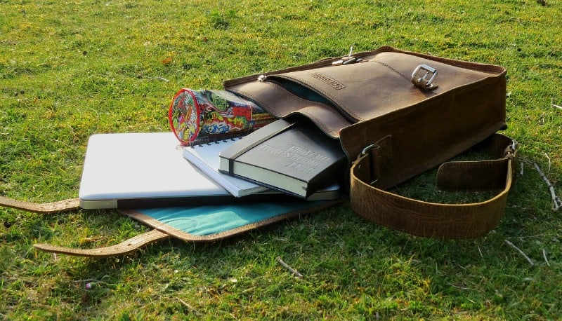 laptop bag with laptop and books