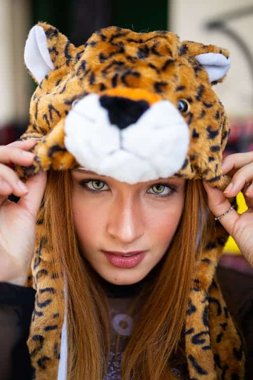 a woman wearing a cheetah hood