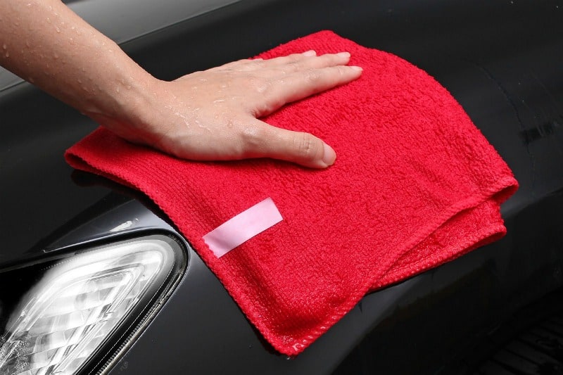 red microfiber cloth cleaning a surface