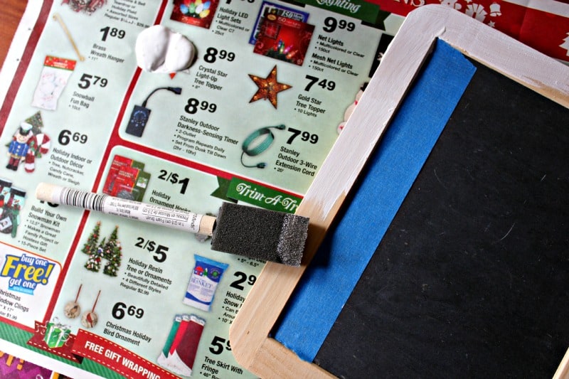 lining a Christmas chalkboard with painter's tape