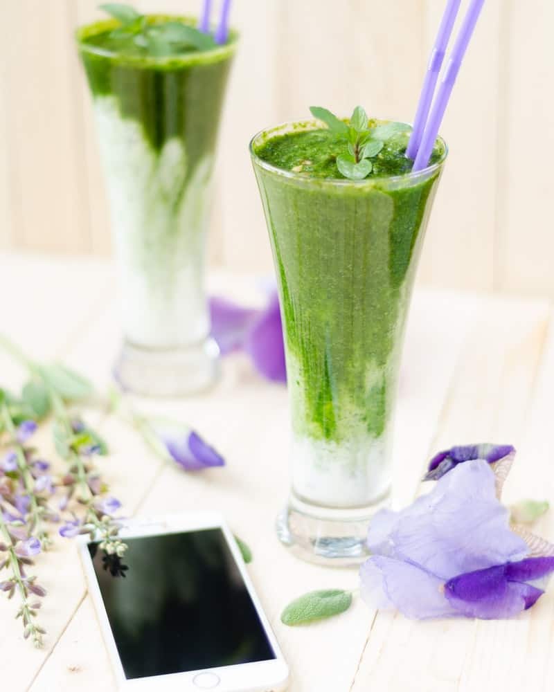 green smoothies in tall thin glasses