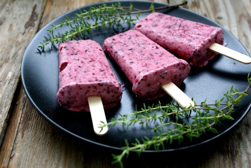 black currant popsicles on a plate