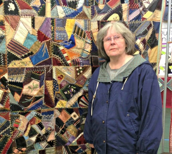 Mom with a special antique quilt