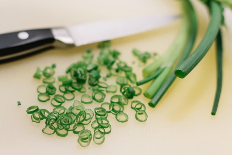 cutting the garlic scapes