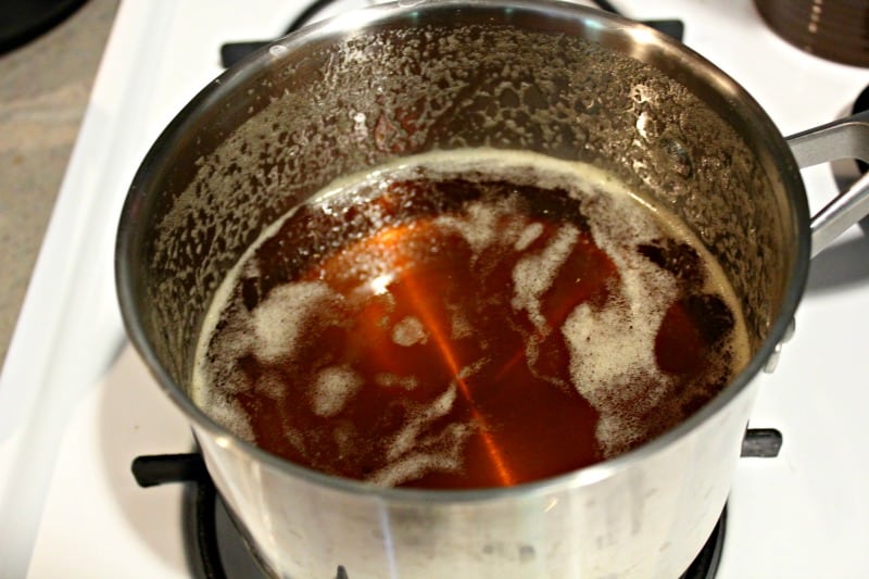 cooking jelly in a silver pot