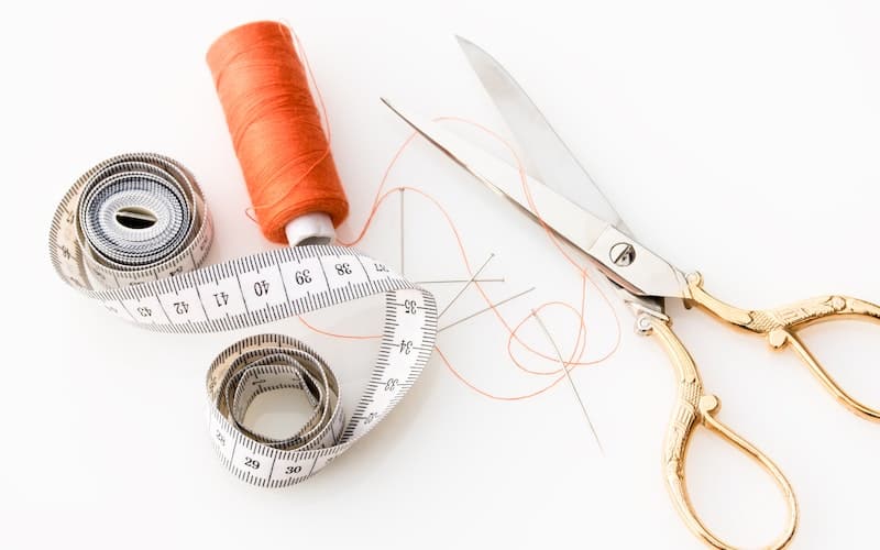 sewing implements on a white background