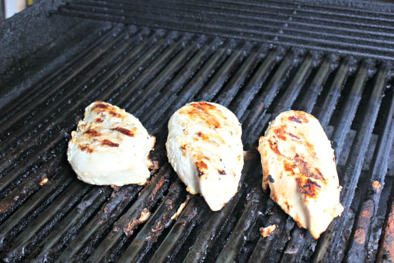 chicken breast cooking on the grill
