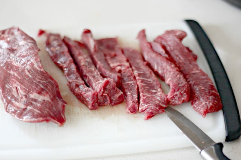 slices of beef on a cutting board