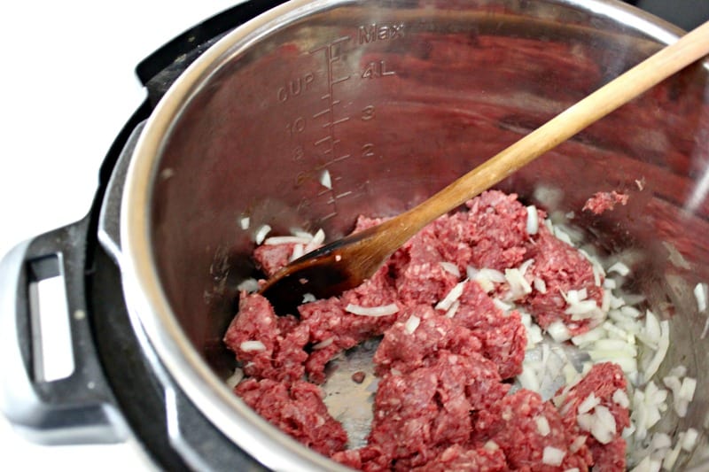stirring ground beef and onions 