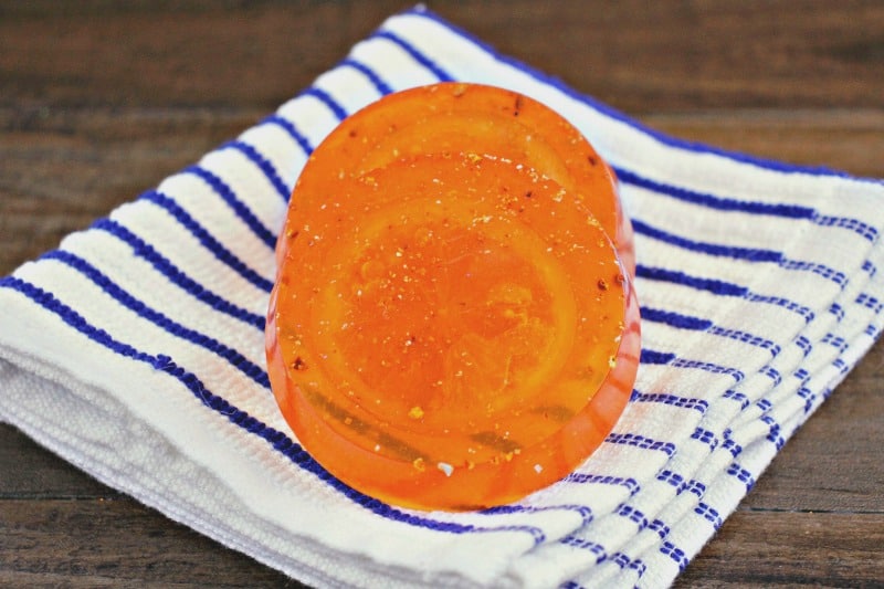 orange peel soap on a blue and white cloth