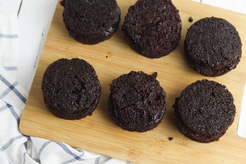 6 chocolate cakes on a cutting board