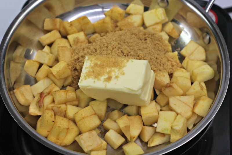 apples cut up with sugar and butter in a pan