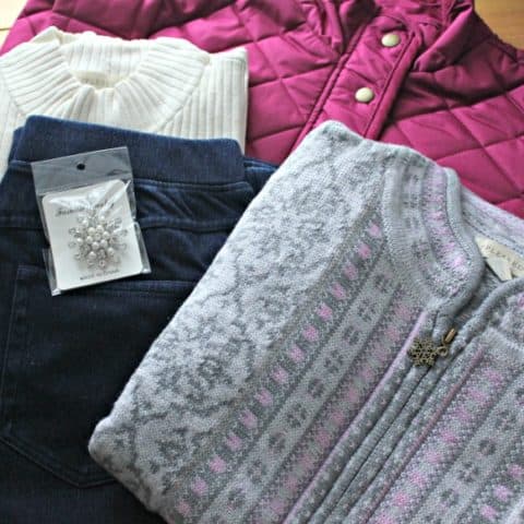 jacket, ivory top, jeans, cardigan and a brooch