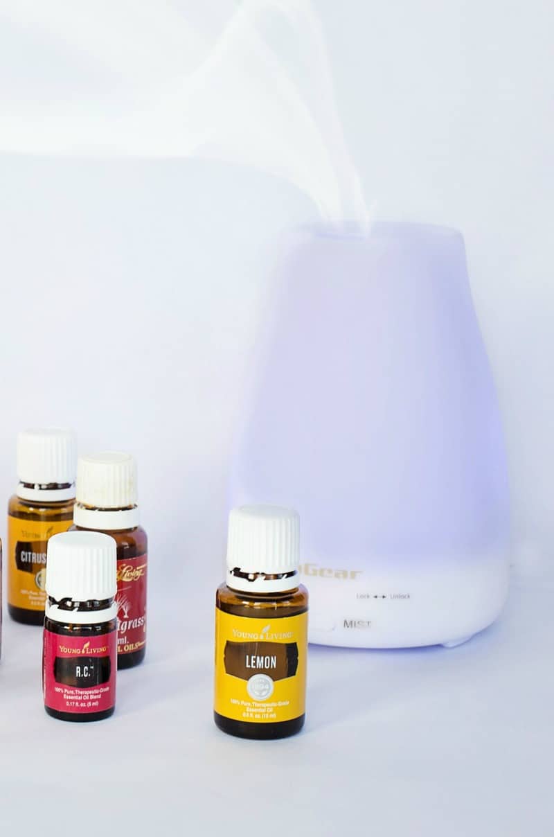 A diffuser and a variety of oils in bottles