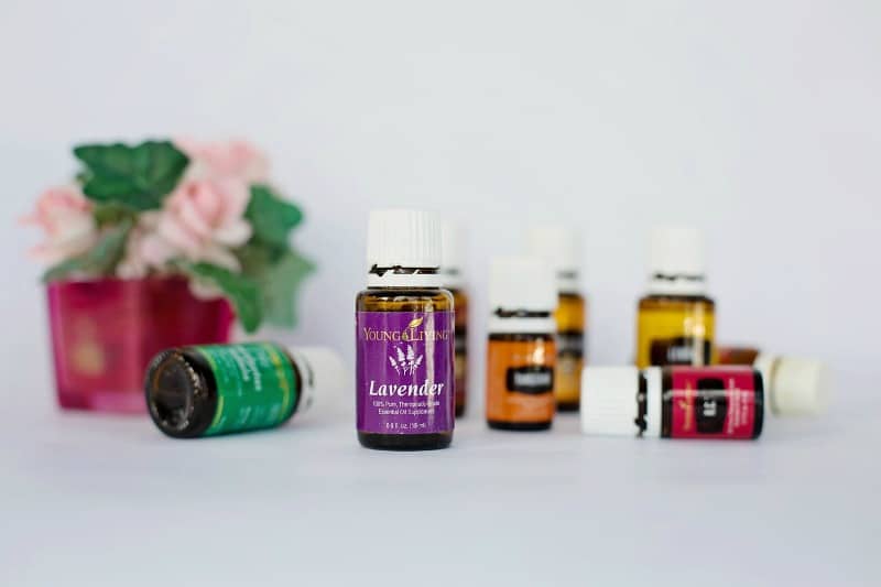 bottles of essential oils on a white table