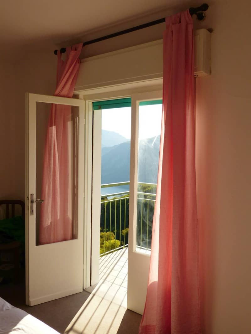 peach curtains hanging over an open door
